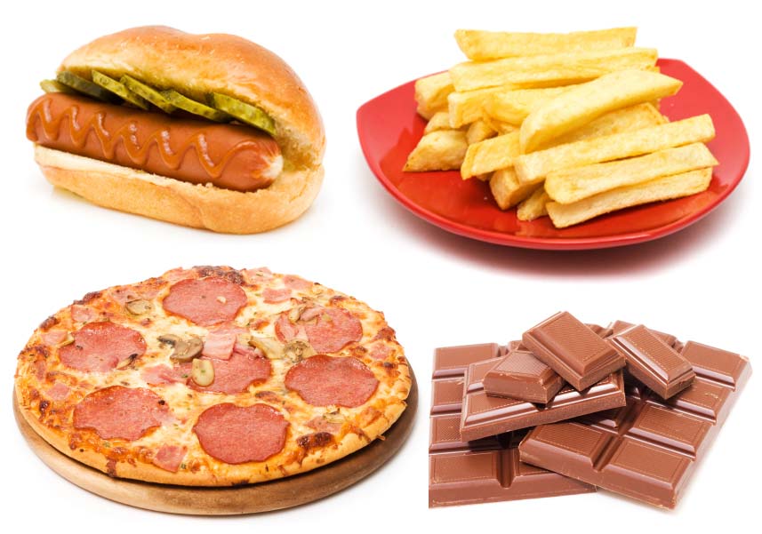 A hot dog, plate of French fries, pizza and chocolate. (stock image)