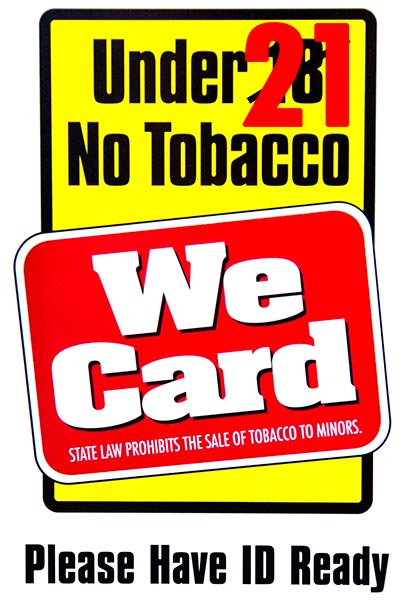Sign reading: Under 21 (18 is crossed out) No Tobacco. We card.