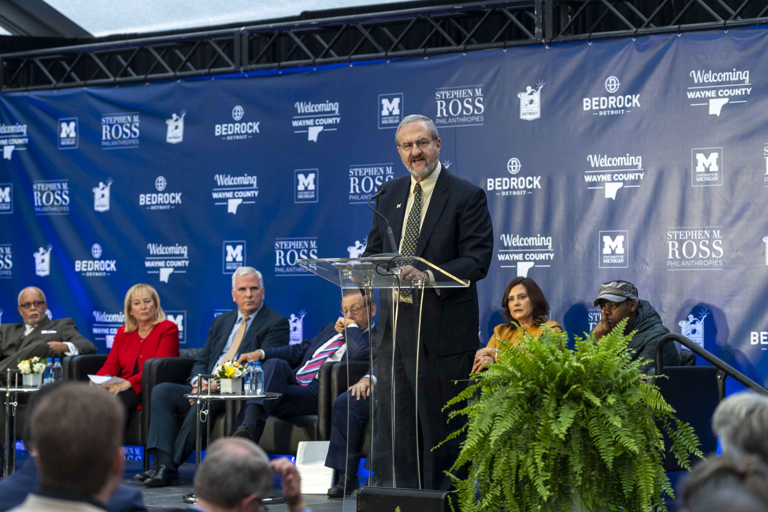 University of Michigan President Mark Schlissel speaks during a press conference announcement of the Detroit Center for Innovation in downtown Detroit on Oct. 30, 2019. Behind him (left to right) are Wayne County Executive Warren Evans, U-M Regent Denise Ilitch, Bedrock CEO Matt Cullen, Related Cos. Chairman Stephen M. Ross and Michigan Governor Gretchen Whitmer. Credit: Scott Soderberg, Michigan Photography.