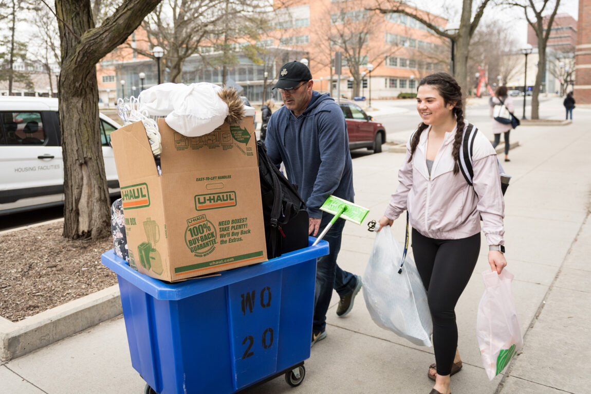 Photo of LSA undergraduate Abigail Yant and her father, Greg, moving back to Indiana. 