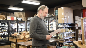 Bill Brinkerhoff working in the new Argus Farm Stop online fulfillment building. Image credit: Michigan Photography
