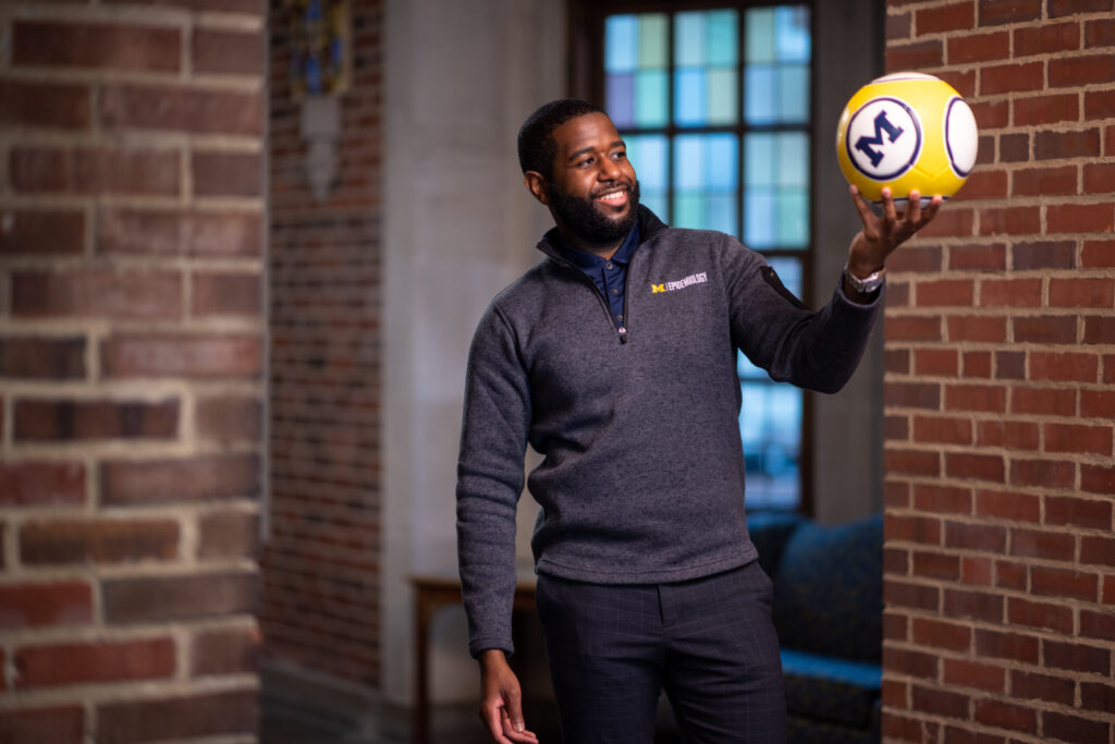 Marcus McKay holding a soccer ball.