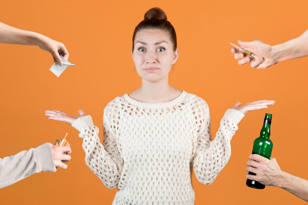 Young woman refusing various illicit substances. Image credit: iStock