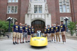 Members of the University of Michigan Solar Car Team pose with the newly unveiled Aevum car on campus. Photo: Bonnie Zhu, Solar Car Team, University of Michigan.
