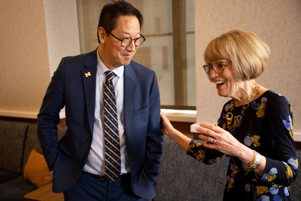 Santa Ono, president-elect of U-M, shares a moment with President Mary Sue Coleman prior to a special meeting of the Board of Regents on July 13. (Roger Hart, Michigan Photography)