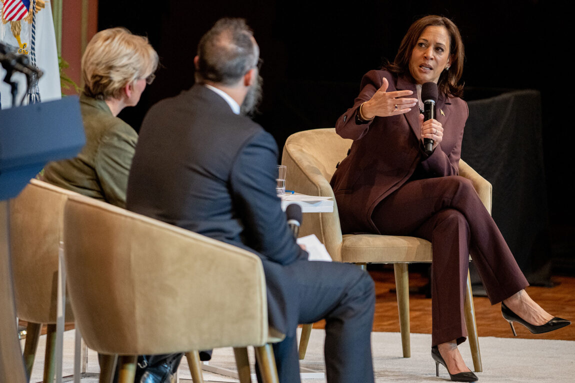 Photo of Vice President Kamala Harris talking with U.S. Energy Secretary Jennifer Granholm and U-M's Kyle Whyte