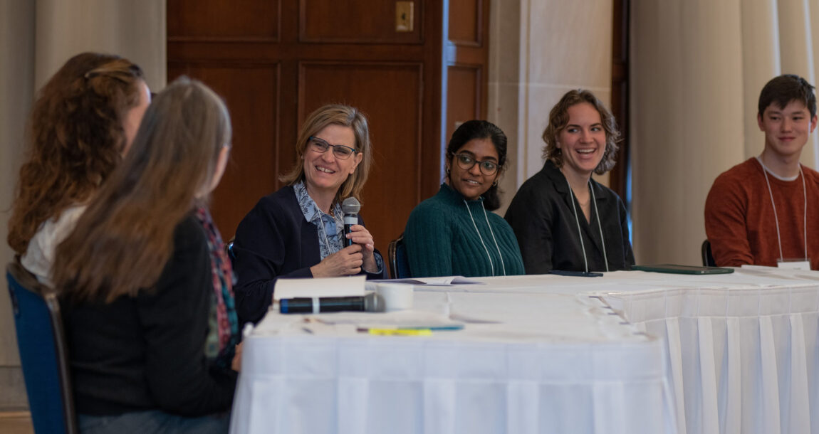 Michaela Zint (middle), associate dean for academic affairs at the School for Environment and Sustainability, speaks with Jennifer Havercamp (left), director of the Graham Sustainability Institute, and students representing multiple disciplines related to climate during the Provost's Seminar on Teaching. (Photo by Dave Brenner, SEAS)