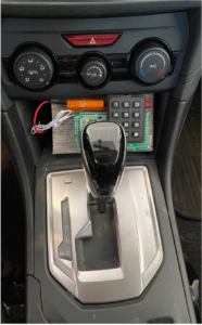 An experimental prototype of the Battery Sleuth code entry device installed in a vehicle. Image credit: Kang Shin