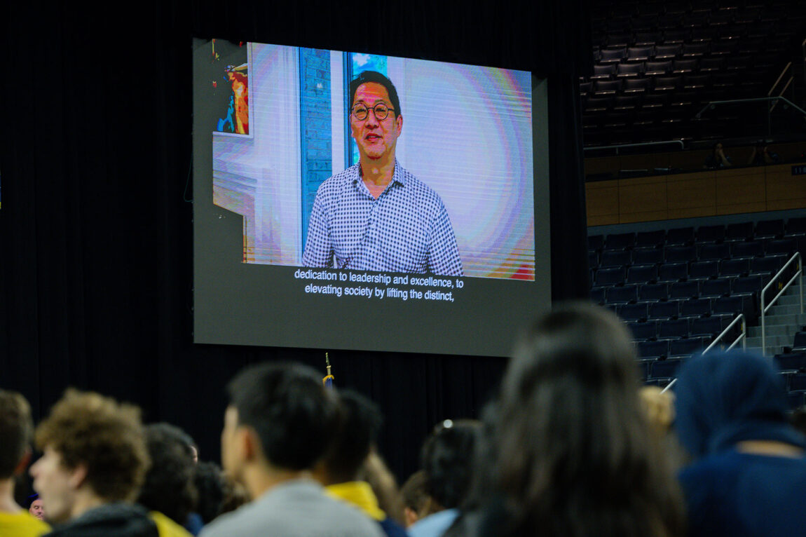 Photo of President Santa J. Ono delivering his welcome remotely on a large screen.