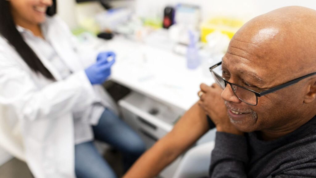 Senior Man Smiling Vaccine Shot. Image credit: Getty Images