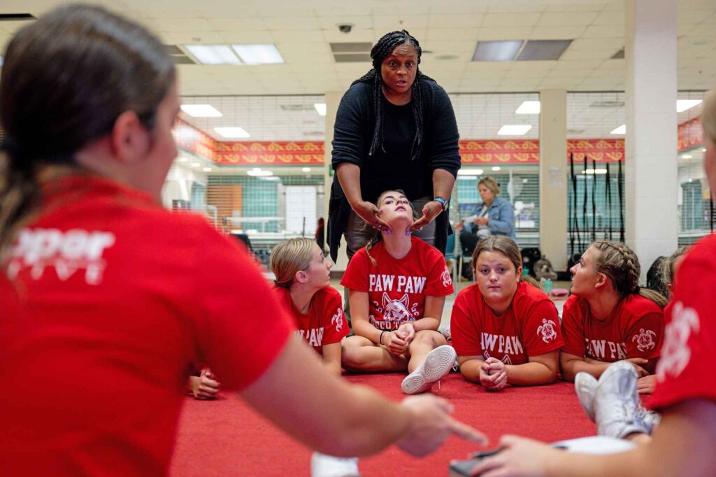 Stefanie Miller, Paw Paw high school math teacher and cheerleading coach, who has been involved in cheerleading since she was in middle school, said when she started "concussion wasn't a word that anybody ever really said." Image credit: Erin Kirkland, Michigan Photography