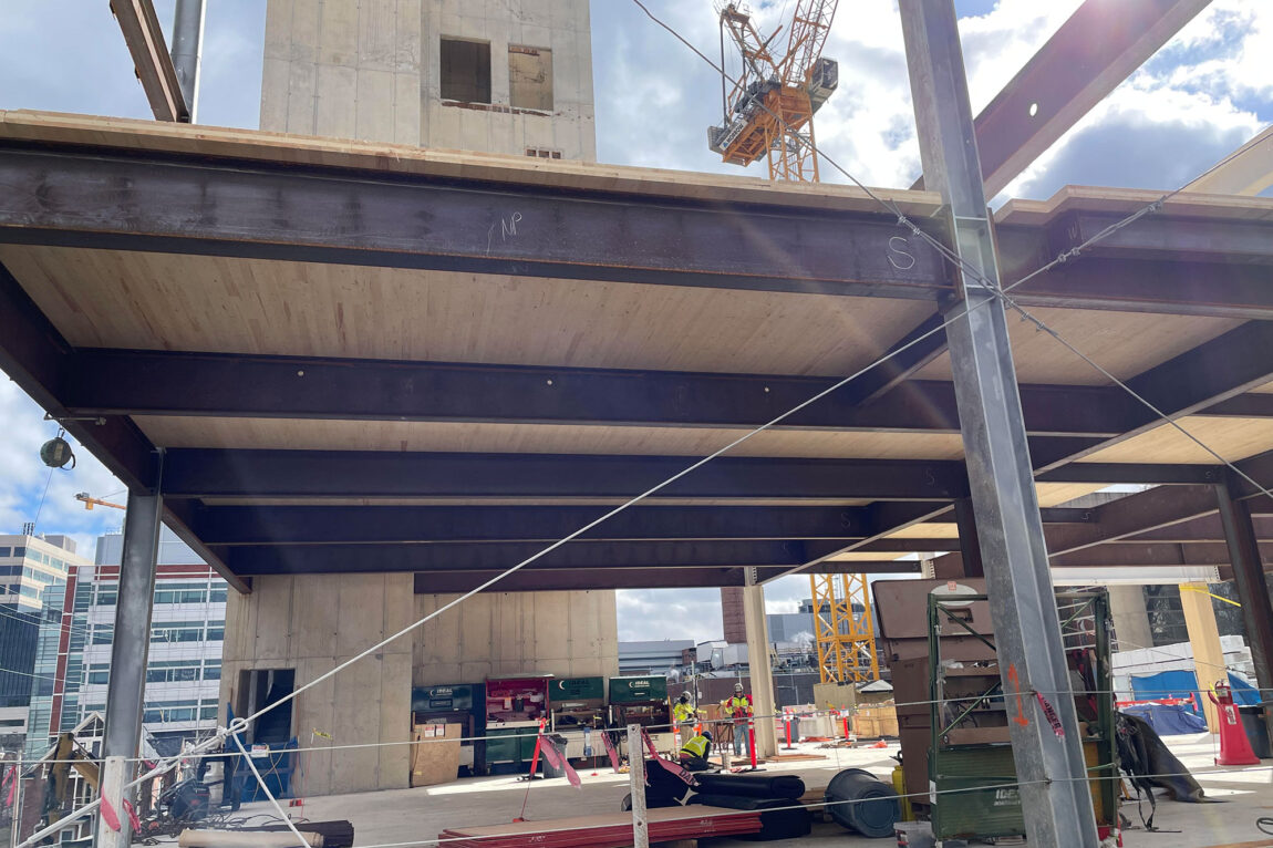 Photo of mass-timber construction efforts are underway at College of Pharmacy building site