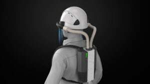 An animation screenshot shows a simulated worker wearing a hardhat connected by two air tubes to a backpack that houses the device’s cold plasma module. Air is shown flowing downward from the brim of the hat.