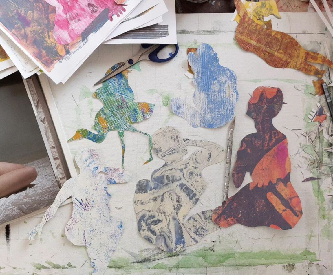 A photo of gel prints on an art table