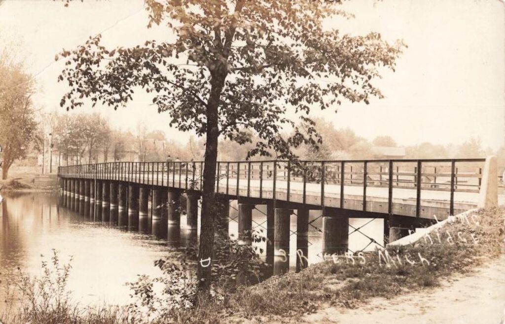 Long bridge in 3 Rivers, Michigan. The subjects listed for this card include bridges and bodies of water. Image credit: David V. Tinder Collection of Michigan Photography, University of Michigan William L. Clements Library.