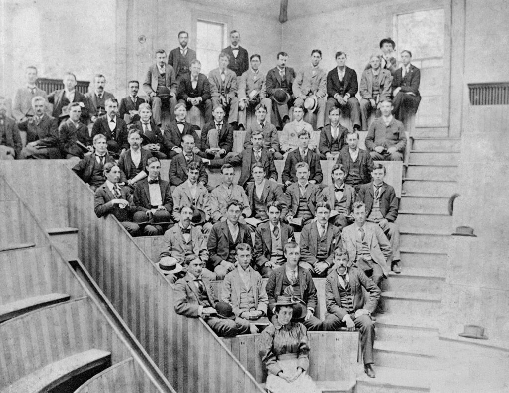 The Class of 1896 poses in a lecture amphitheater at the dental school.