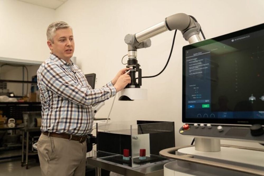 Man with scientific imaging medical equipment