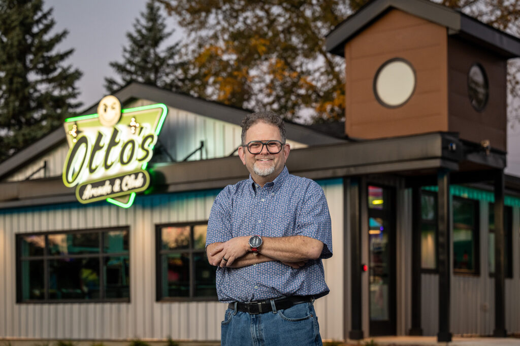 Mitch Rohde standing outside Otto's Arcade and Club in Saline, Michigan.