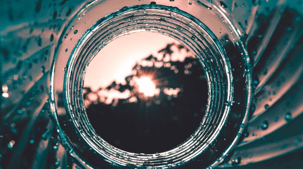 A view of the sunset through a water bottle. Image credit: Revieshan, Pixabay