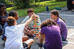Campers play therapeutic Jenga and other activities at camp. Image credit: Jeremy Marble, University of Michigan News
