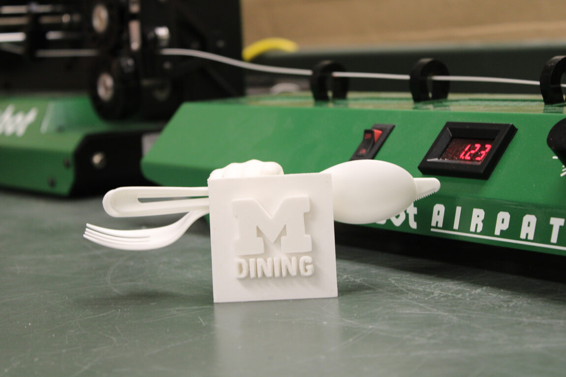 A utensil holder that a 3D printer made from compostable utensils