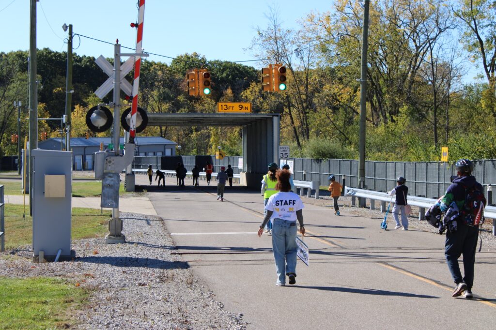 Kids going through a tunnel after learning how to safely cross railroad tracks. Image credit: Juan Ochoa