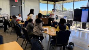 Student assistant Aidan Shoresh explaining and leading the crash-test car building exercise. Image credit: Juan Ochoa