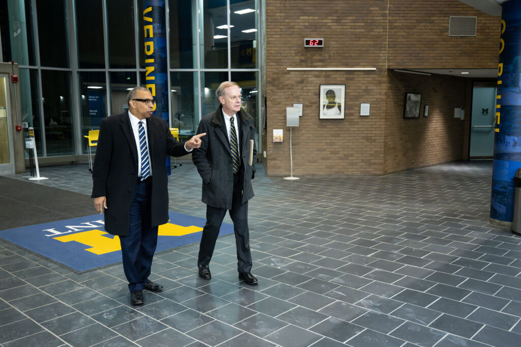 Two men tour a building