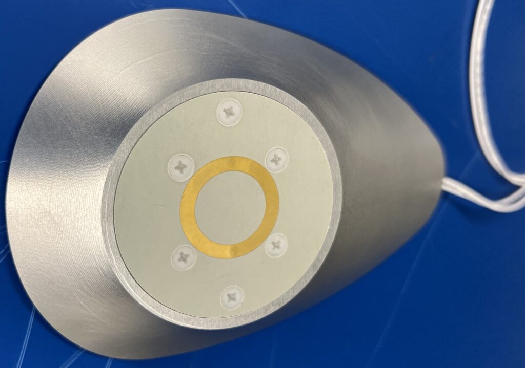 This flat sensor emits microwaves, which can help pilots know when ice is forming on the surface of a plane. Image courtesy: Nilton Renno, University of Michigan.