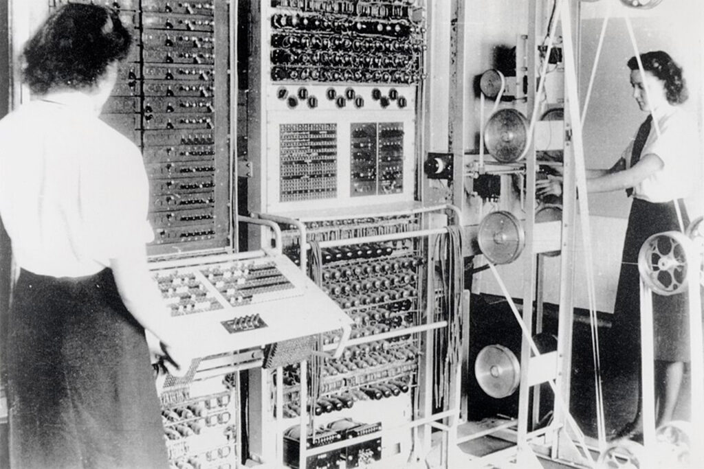 A Colossus Mark 2 codebreaking computer being operated by Dorothy Du Boisson (left) and Elsie Booker (right), 1943. Image credit: Public Domain