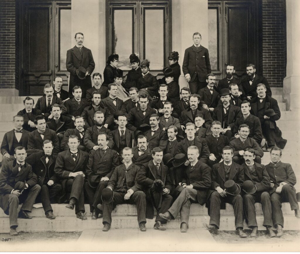 Class of 1880 group photo, with Mollie Graham sitting at the top