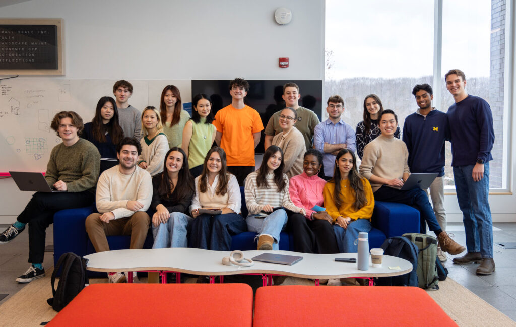 Group of students posing around a couch