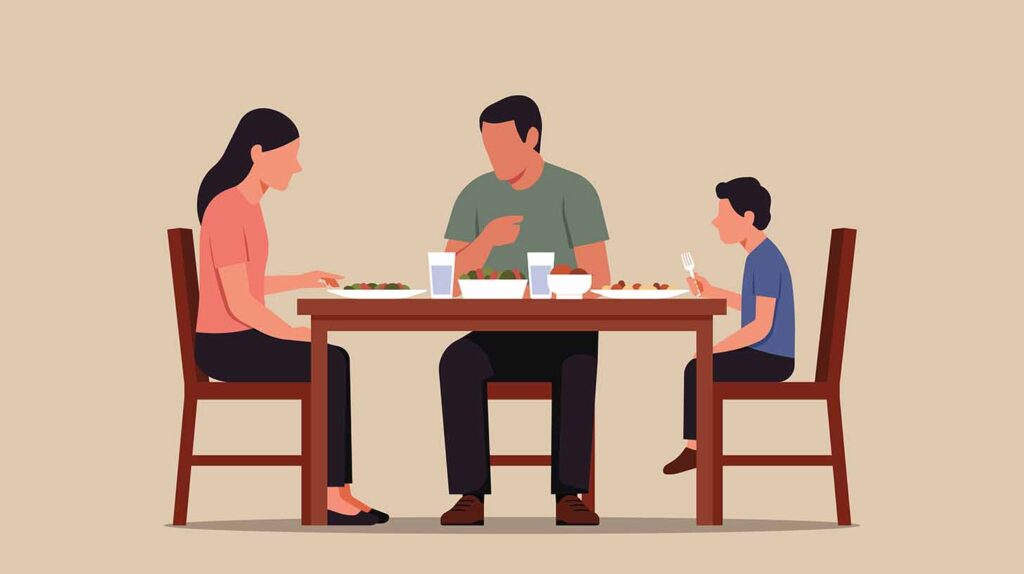 Family of three sits at dinner table without speaking, showing quiet tension. Image credit: Adobe Stock