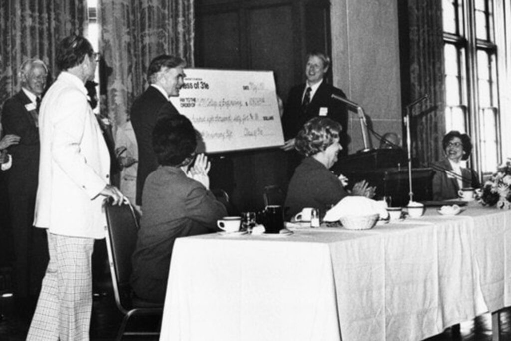 Paul Bigby, president of the Michigan Engineering Class of 1931, presenting Dean James Duderstadt with a check to start the Class of ’31E Fund in 1981.