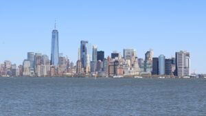 The New York city skyline stretches above the surrounding waters of the Upper Bay.