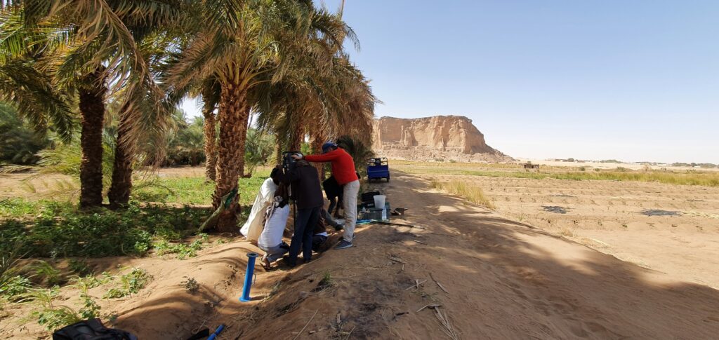 A team of Sudanese workers takes sediment core samples from the Nile River valley near Jebel Barkal. Image credit: Pawel Wolf, Jebel Barkal Archaeological Project