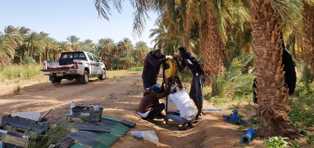A team of Sudanese workers takes sediment core samples from the Nile River valley near Jebel Barkal. Image credit: Pawel Wolf, Jebel Barkal Archaeological Project