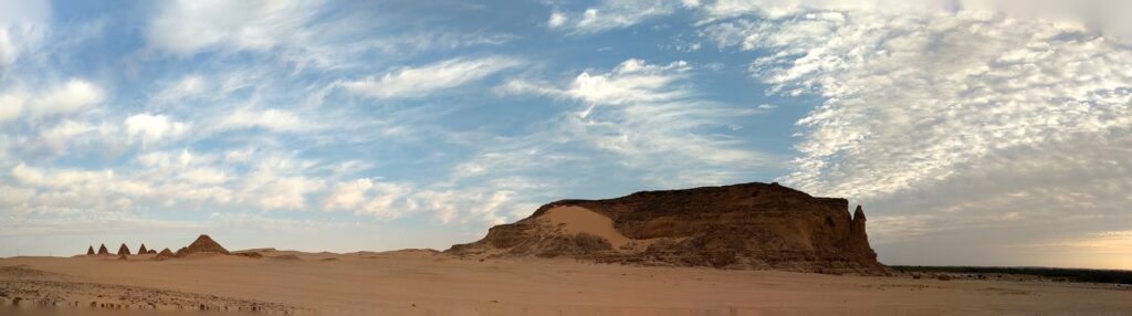 Panoramic view of Jebel Barkal (ancient Napata), a UNESCO World Heritage site in northern Sudan, with its sandstone outcrop and royal pyramids. Image credit: Gregory Tucker, 2018