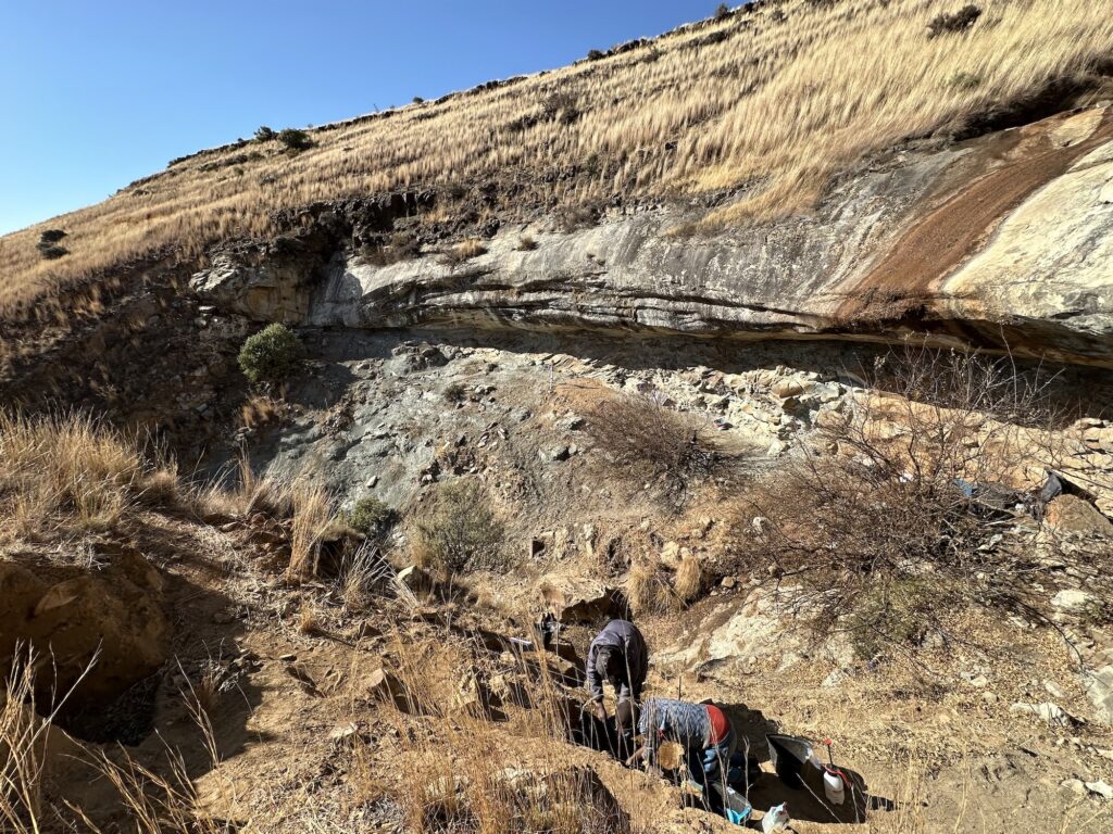 Local archaeologist Molopi Matela and Lefa Leanya of Stellenbosch University, South Africa, work at the Likonong Rock Shelter in the mountains of Lesotho. Here, an international team of archaeologists from the United States, Canada, the United Kingdom, and Lesotho have identified the earliest sustained human occupation in Highland Southern Africa. Image credit: Kyra Pazan, California State University, Stanislaus