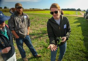 Etienne Sutton holds up a cover crop plant while talking with farmers at Michigan State University W.K. Kellogg Biological Station, Hickory Corners, Mich. Image credit: Jeremy Marble, University of Michigan News