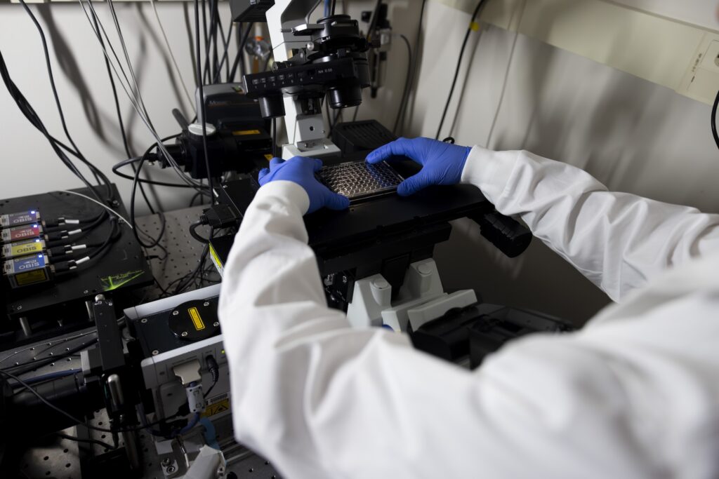 Yongkang Xi, Research Fellow for Mechanical Engineering, places a plate containing samples of tardigrade proteins under a microscope at GG Brown on North Campus of the University of Michigan in Ann Arbor, MI on April 22, 2026. Image credit: Jeremy Little, Michigan Engineering